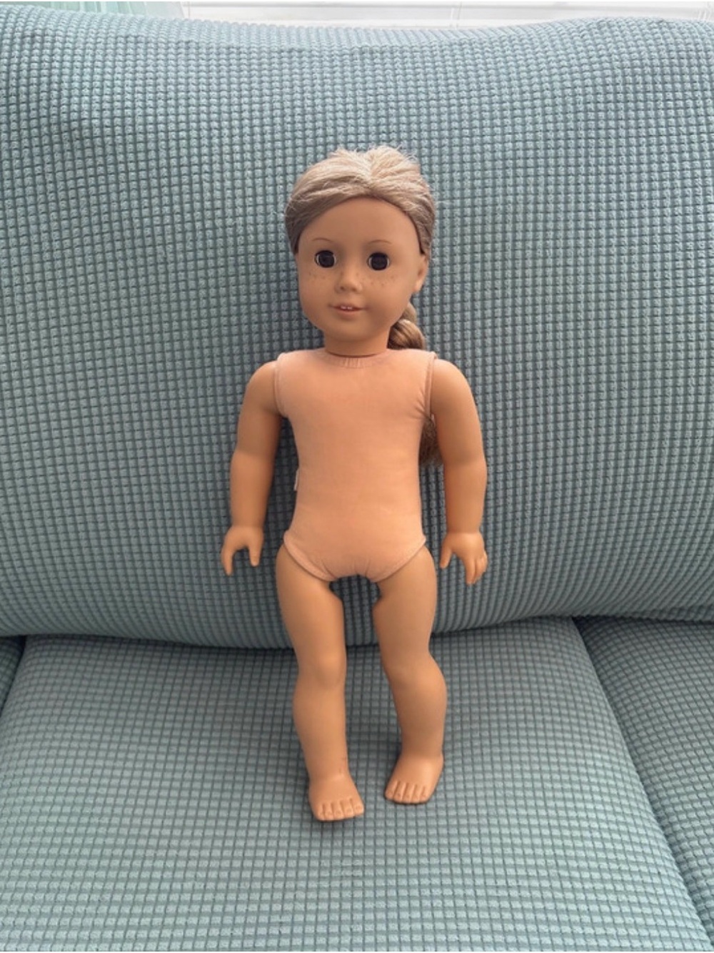 American Girl Doll with blonde hair, brown eyes, and freckles